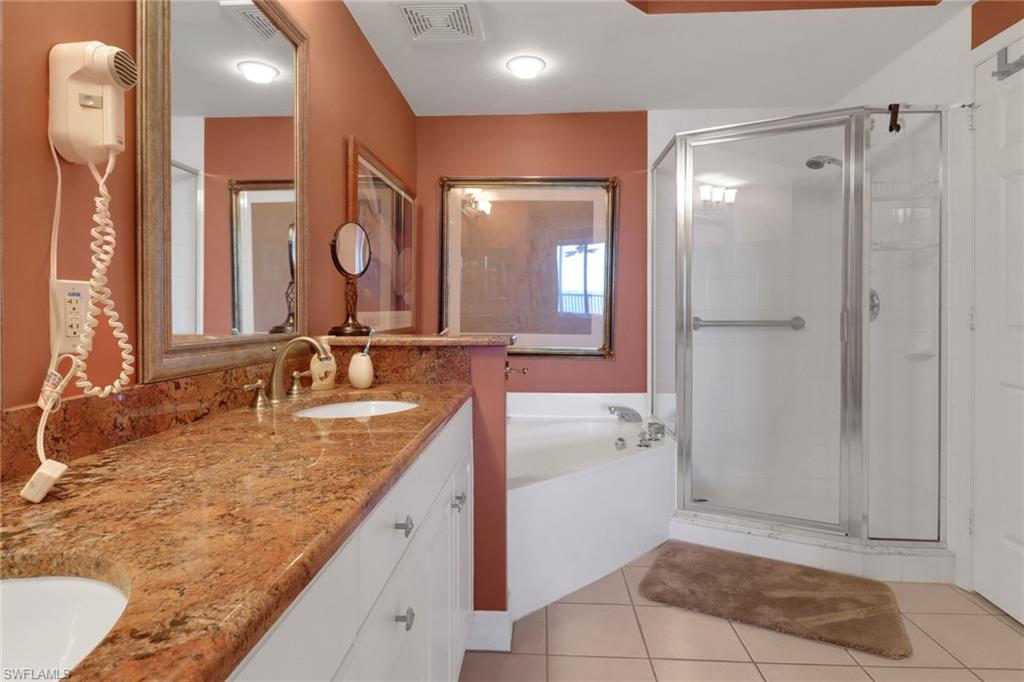 2797 First Street, Unit 1001 Fort Myers, FL 33916 - Photo 19 of 41 a bathroom with a granite countertop sink and a mirror