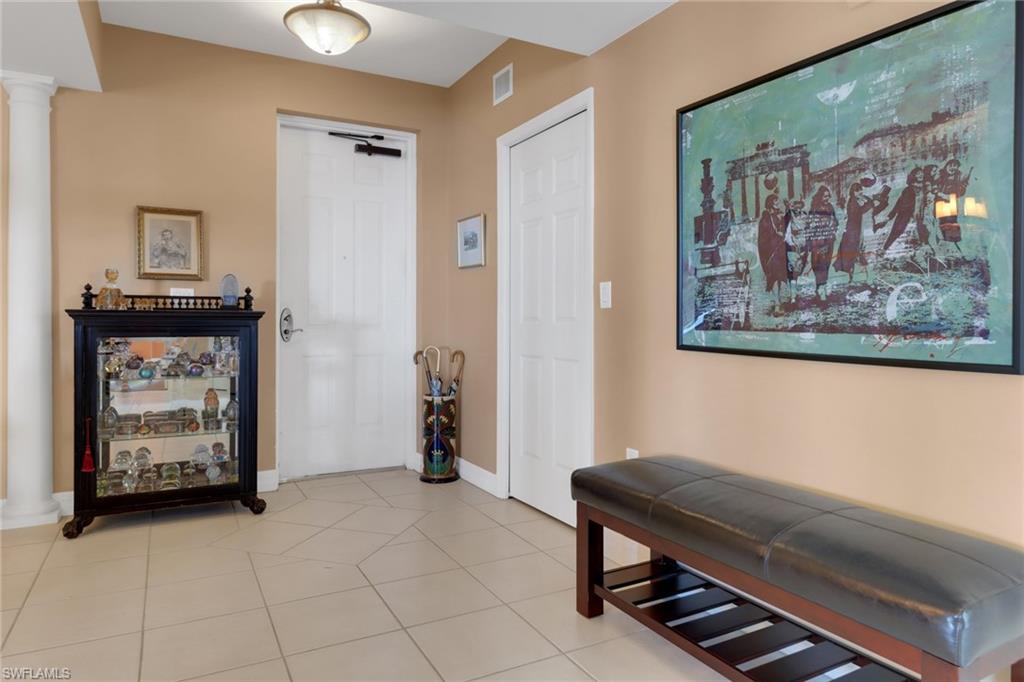 2797 First Street, Unit 1001 Fort Myers, FL 33916 - Photo 2 of 41 a room with furniture and paintings on the wall