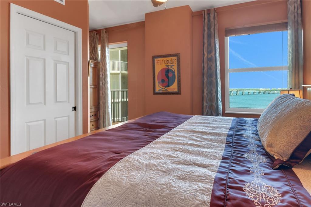 2797 First Street, Unit 1001 Fort Myers, FL 33916 - Photo 21 of 41 a bedroom with a bed and a window