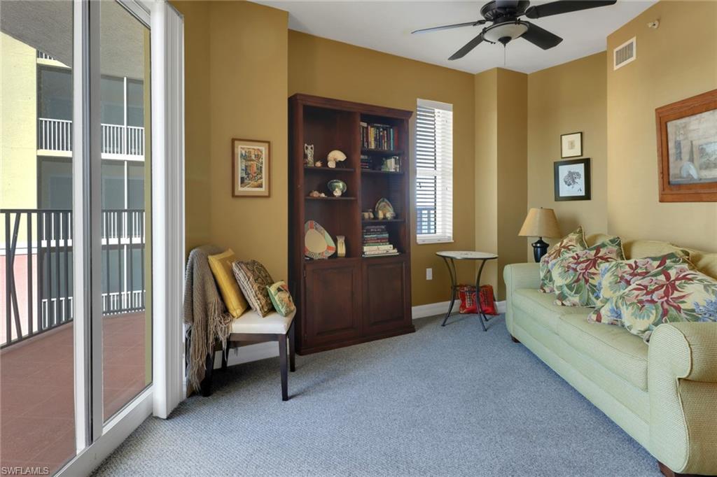 2797 First Street, Unit 1001 Fort Myers, FL 33916 - Photo 23 of 41 a bed room with a bed and a chair