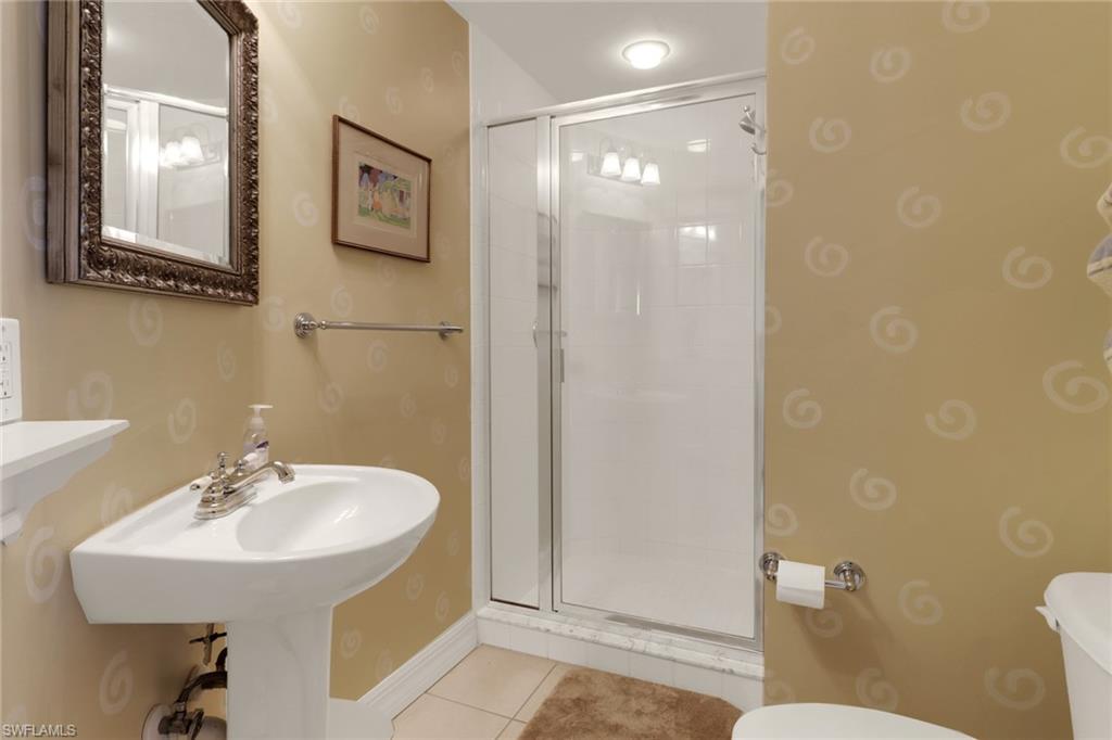 2797 First Street, Unit 1001 Fort Myers, FL 33916 - Photo 28 of 41 a bathroom with a sink and mirror