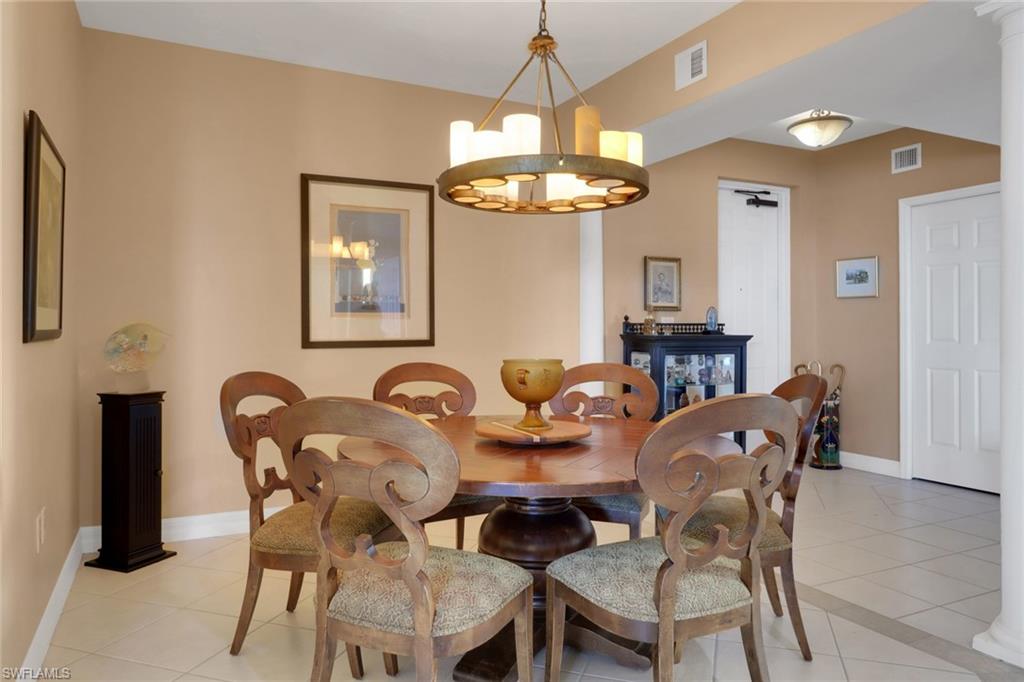 2797 First Street, Unit 1001 Fort Myers, FL 33916 - Photo 3 of 41 a view of a dining room with furniture and chandelier