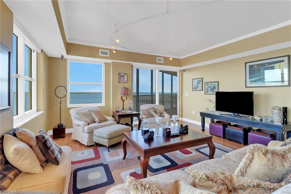 2797 First Street, Unit 1001 Fort Myers, FL 33916 - Photo 10 of 41 a living room with furniture and a flat screen tv