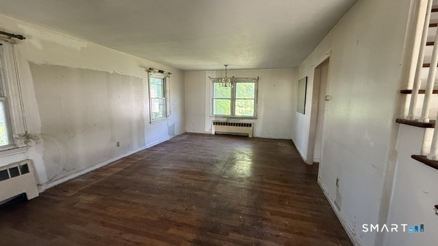 131 Bryden Terrace Hamden, CT 06517 - Photo 5 of 16 a view of a livingroom with wooden floor and a window