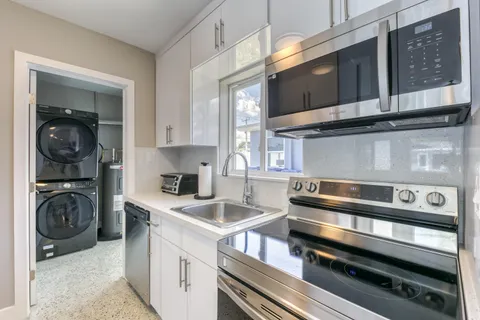 a kitchen with a stove and a microwave