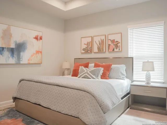 a bedroom with a bed and a couch