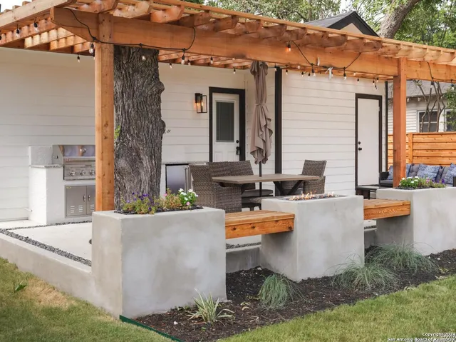 a view of a patio with couches chairs and a fire pit