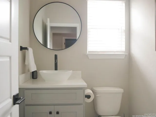 a bathroom with a toilet and a sink