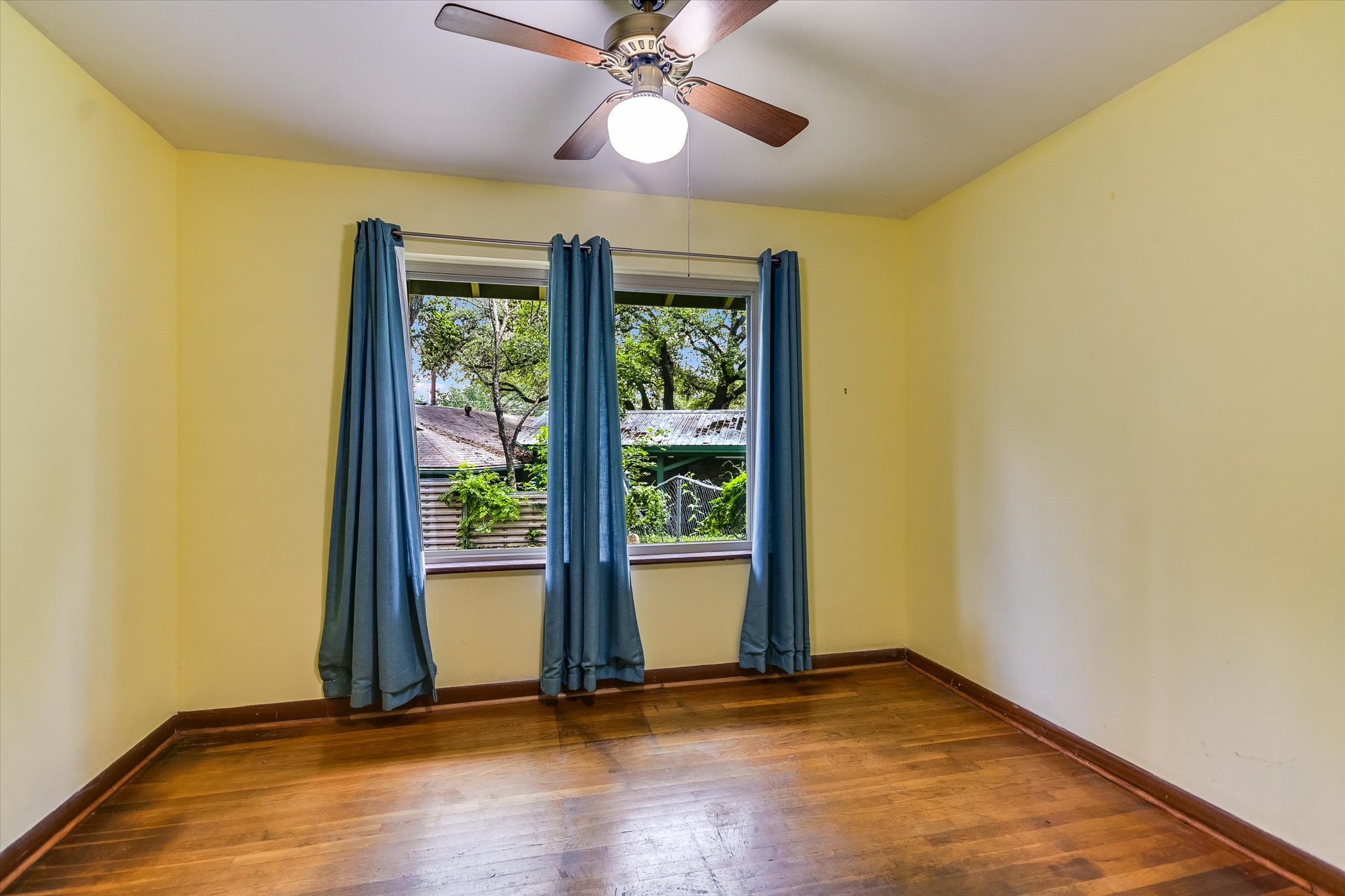 502 Sunset Circle Austin, TX 78704 - Photo 17 of 27 Hardwood floors + window