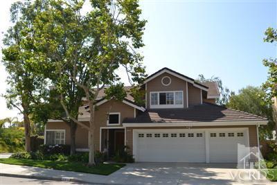 11653 Chestnut Ridge Street Moorpark, CA 93021 - Photo 1 of 17 a front view of a house with a garden