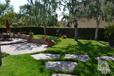 11653 Chestnut Ridge Street Moorpark, CA 93021 - Photo 14 of 17 a backyard of a house with lots of green space