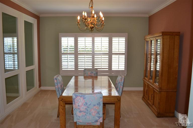 11653 Chestnut Ridge Street Moorpark, CA 93021 - Photo 3 of 17 a view of a dining room with furniture window and wooden floor