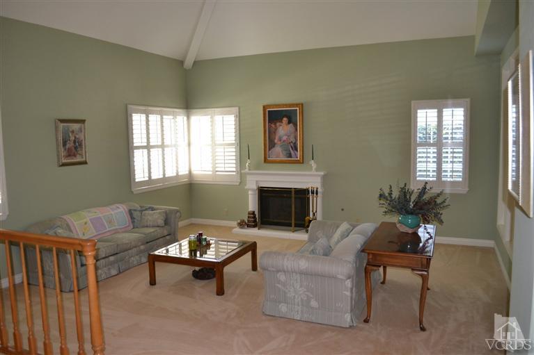 11653 Chestnut Ridge Street Moorpark, CA 93021 - Photo 4 of 17 a living room with furniture and a fireplace