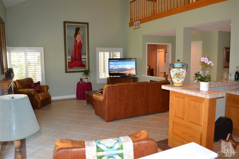11653 Chestnut Ridge Street Moorpark, CA 93021 - Photo 7 of 17 a living room with furniture and a flat screen tv