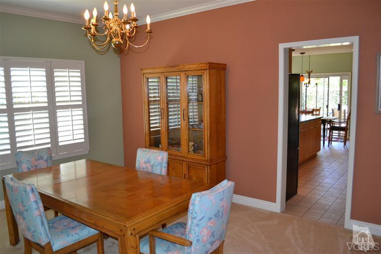 11653 Chestnut Ridge Street Moorpark, CA 93021 - Photo 8 of 17 a view of a dining room with furniture wooden floor and chandelier