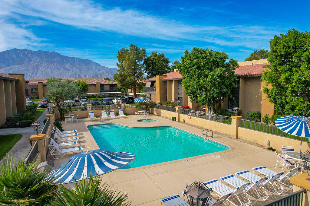 a view of a swimming pool with a patio