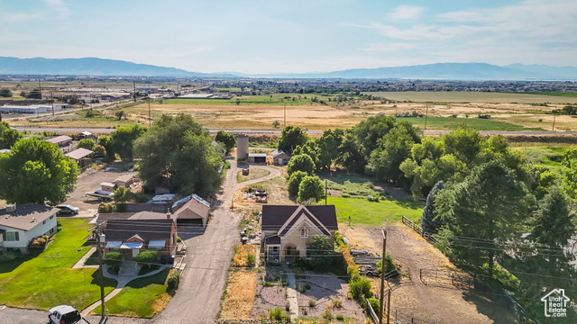1632 South Main Street Springville, UT 84663 - Photo 28 of 93 Aerial view of property and surrounding area with a mountainous background