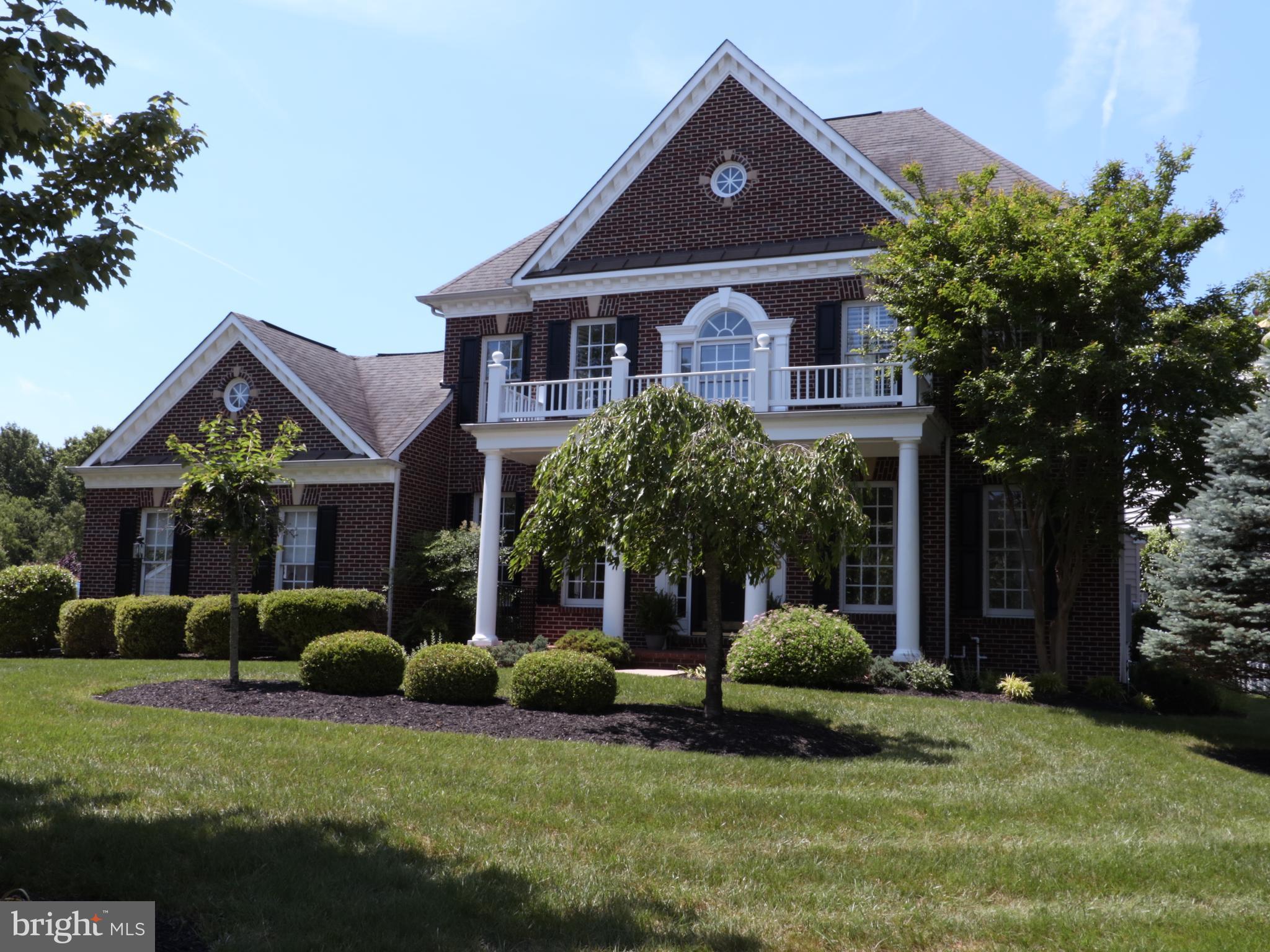 18308 Crestmount Road Boyds, MD 20841 - Photo 2 of 24 a front view of a house with a yard