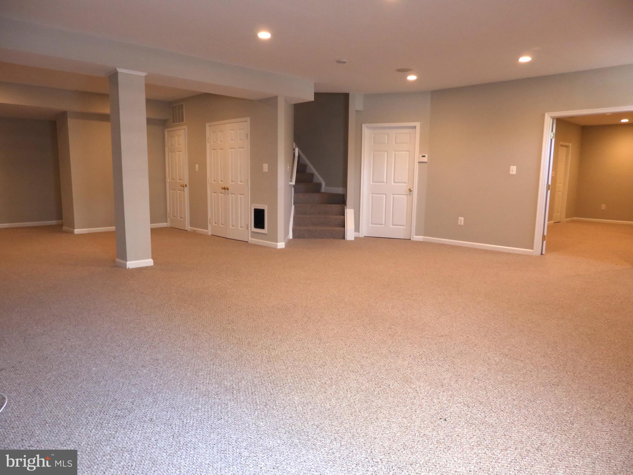 18308 Crestmount Road Boyds, MD 20841 - Photo 19 of 24 an empty room with a kitchen