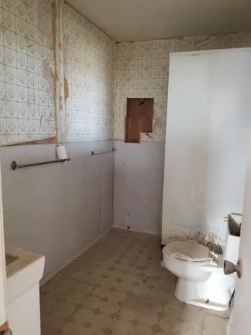 a room with gym equipment and a large window