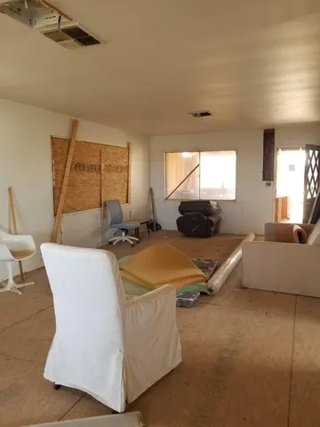 a living room with furniture and a rug