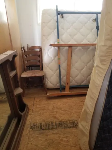 a bathroom with a granite countertop toilet and a sink
