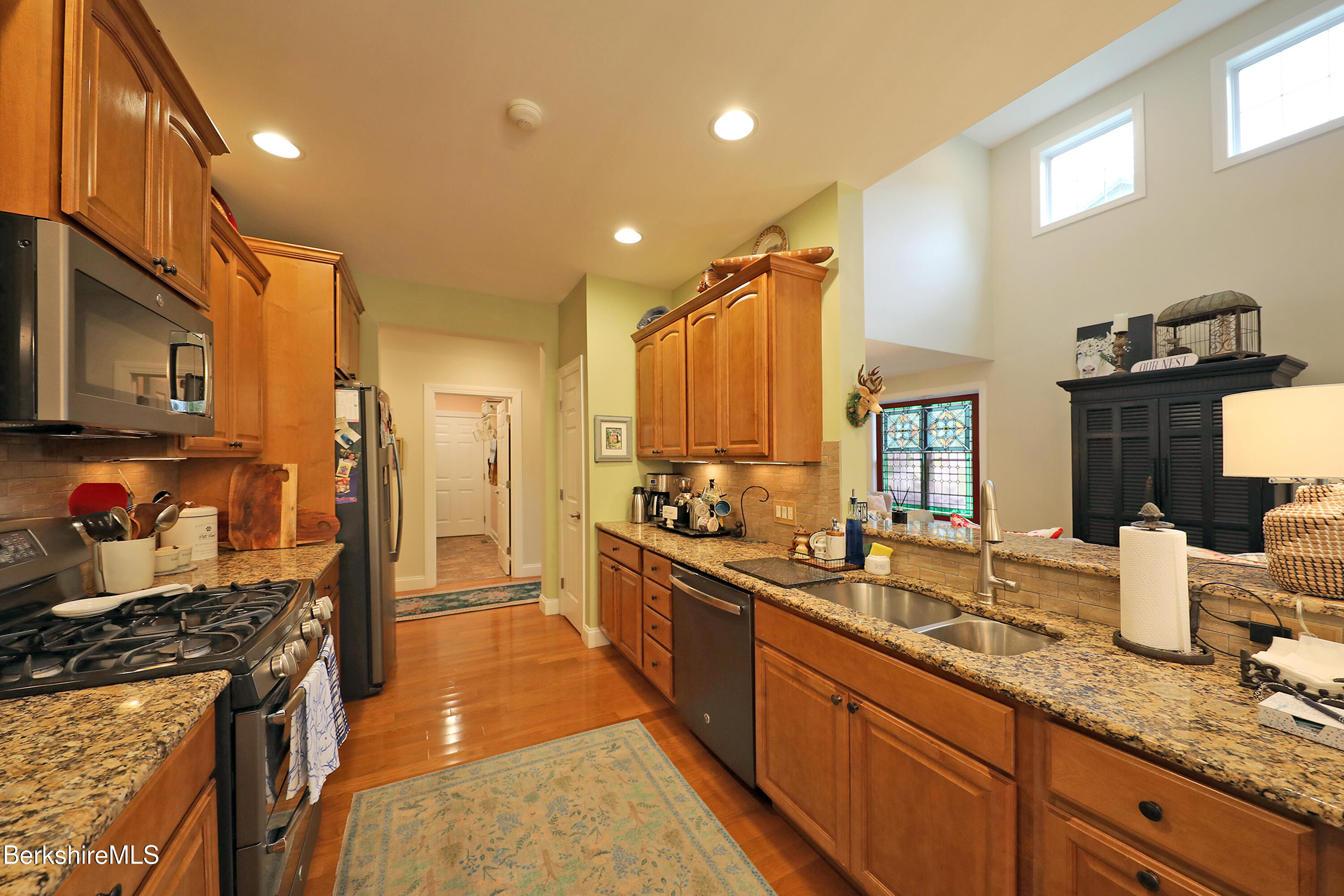 103 Alpine Trail Pittsfield, MA 01201 - Photo 16 of 39 a kitchen with stainless steel appliances a sink stove and refrigerator