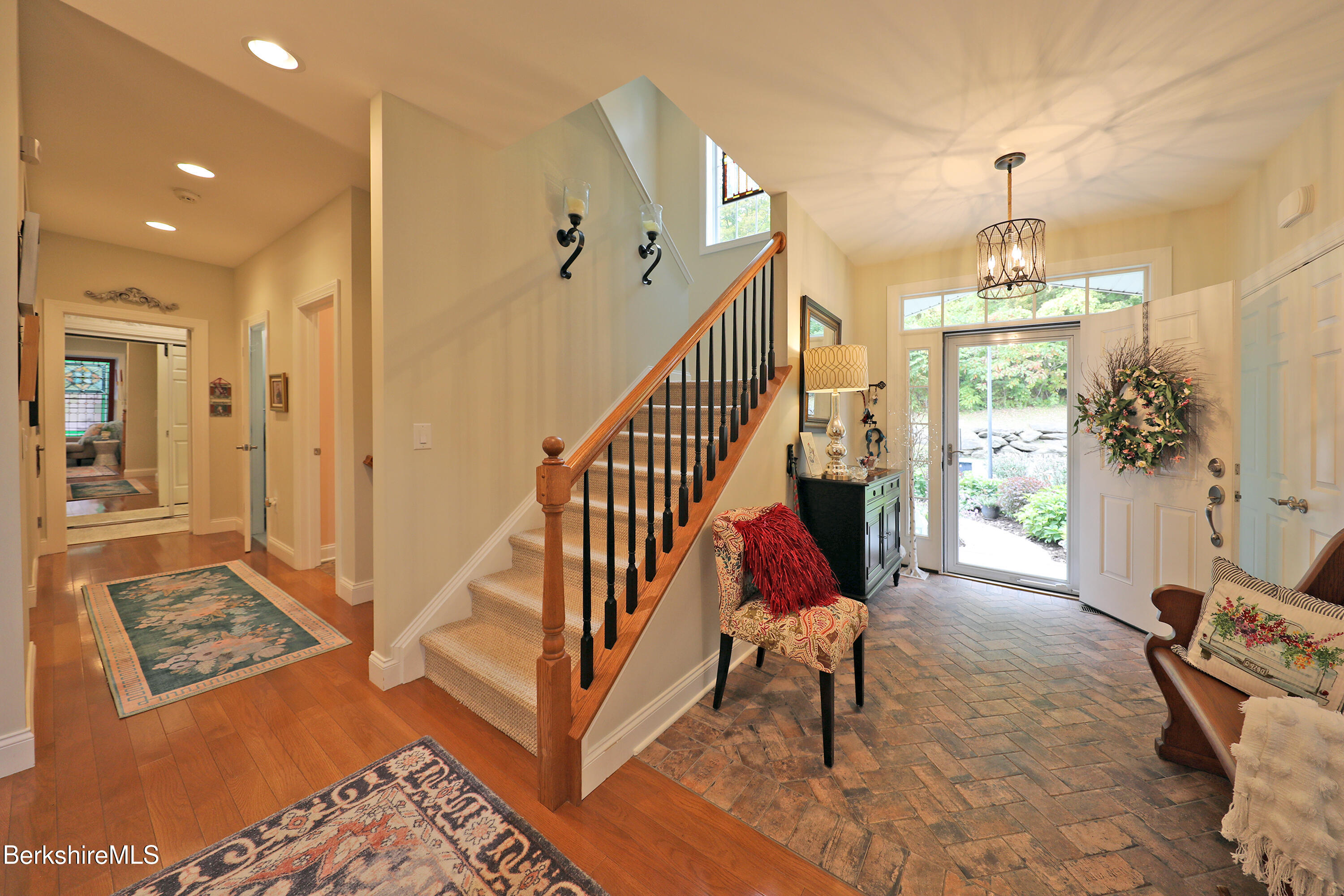 103 Alpine Trail Pittsfield, MA 01201 - Photo 6 of 39 a living room with furniture and a chandelier