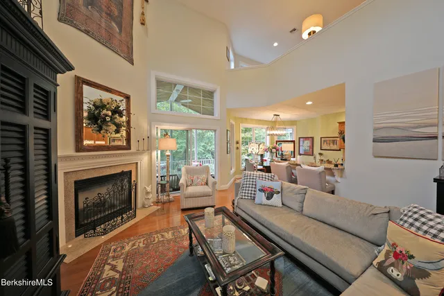 a living room with furniture fireplace and window