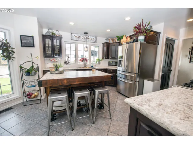 a kitchen with a table and chairs in it