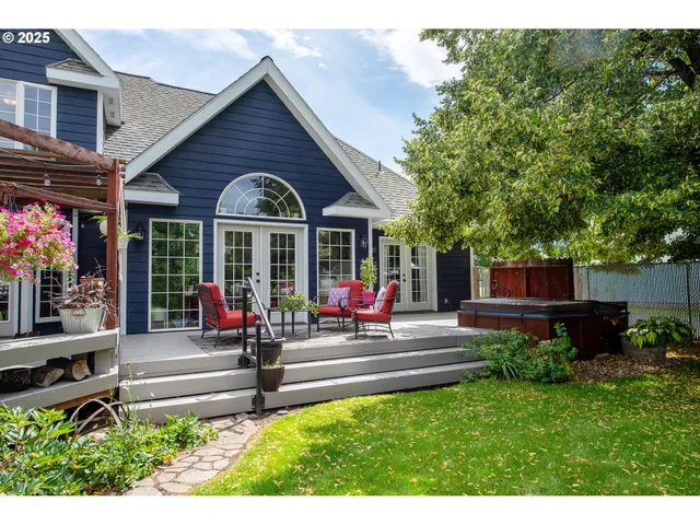 a view of a house with sitting area and garden