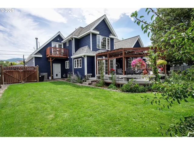 a front view of a house with a yard table and chairs
