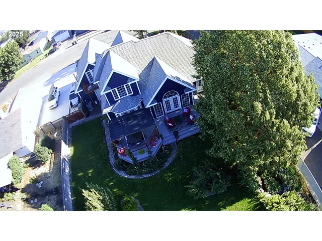 an aerial view of a house with a garden