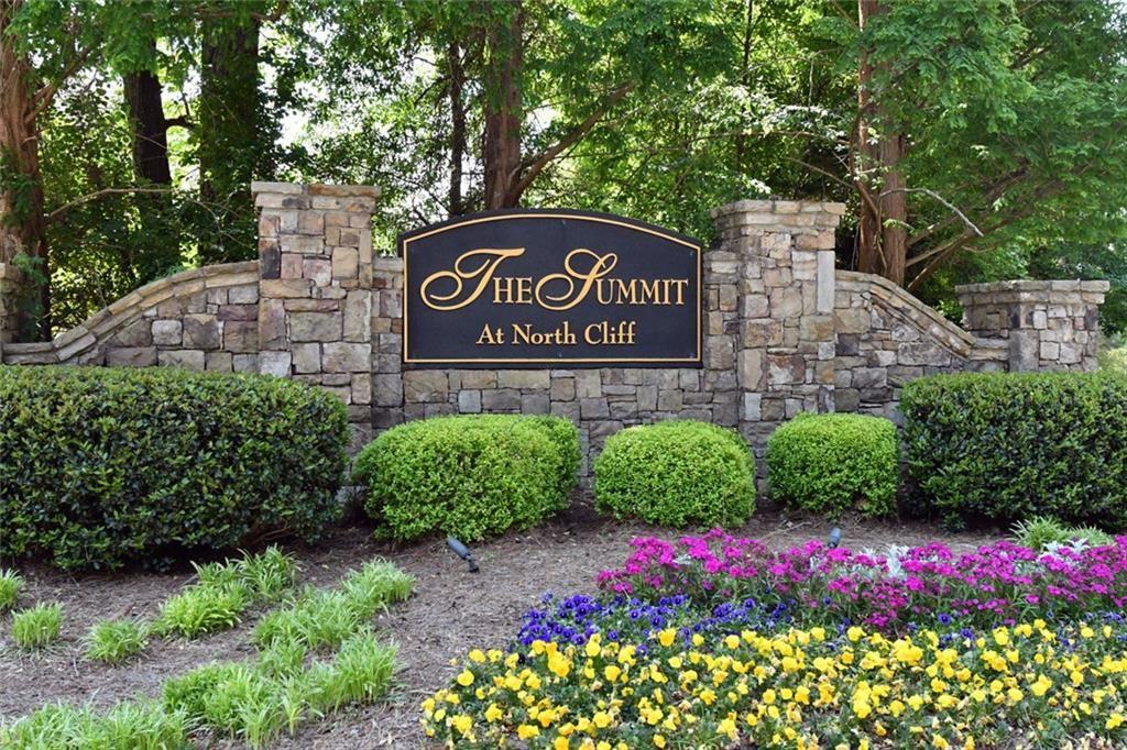 795 Sunset Ridge Lane Southeast Lawrenceville, GA 30045 - Photo 47 of 47 a sign that is sitting in front of flowers