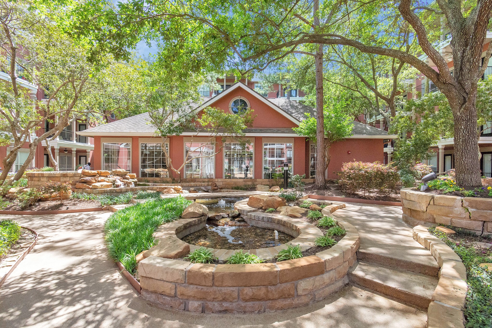 2400 McCue Road, Unit 424 Houston, TX 77056 - Photo 32 of 33 a front view of a house with a yard fountain