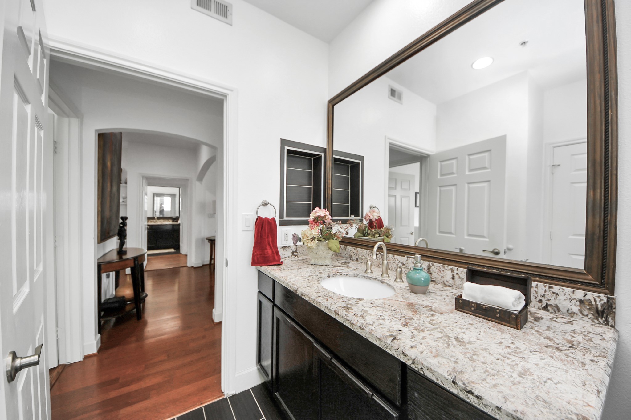 2400 McCue Road, Unit 424 Houston, TX 77056 - Photo 9 of 33 a bathroom with a granite countertop sink and a mirror