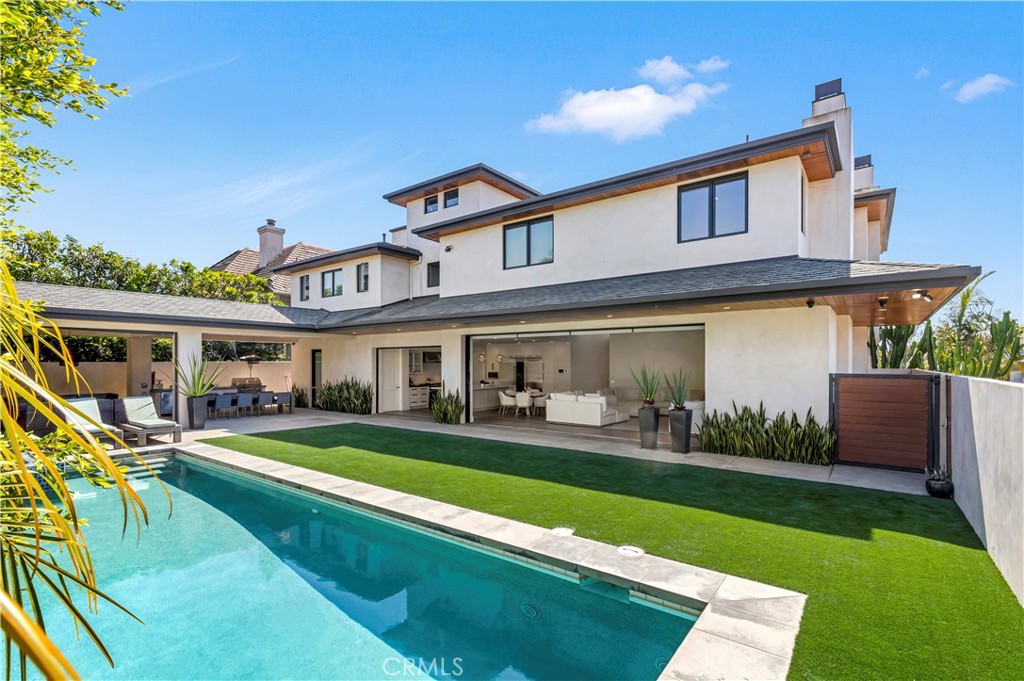 660 Kings Road Newport Beach, CA 92663 - Photo 10 of 41 a view of a house with a yard porch and sitting area
