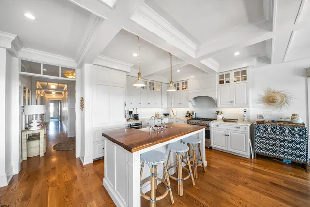 a living room with kitchen island furniture and a table