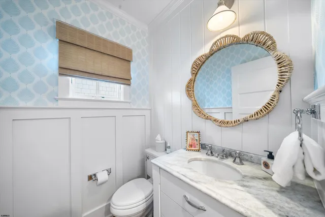 a bedroom with bed and a window