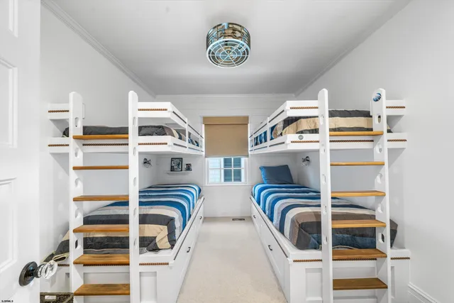 a bathroom with a granite countertop sink a toilet a mirror a bathtub and shower