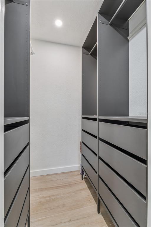 5124 Conroy Road, Unit 24 Orlando, FL 32811 - Photo 11 of 26 a view of an empty walk in closet