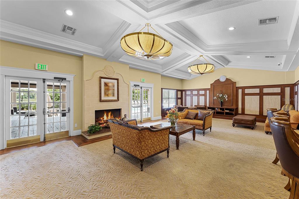 5124 Conroy Road, Unit 24 Orlando, FL 32811 - Photo 17 of 26 a living room with fireplace furniture and a large window