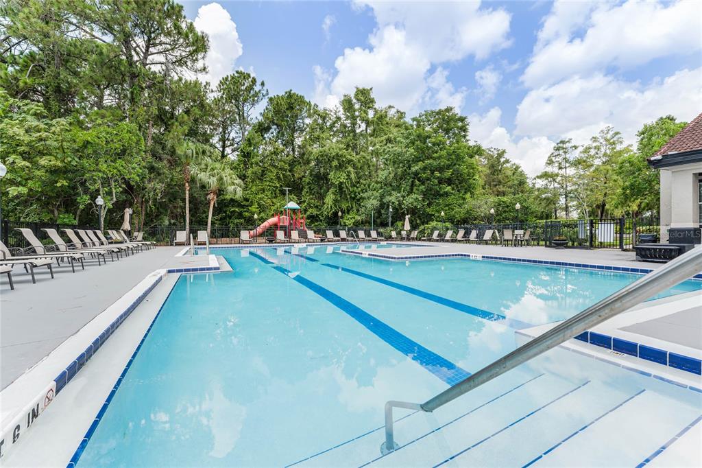 5124 Conroy Road, Unit 24 Orlando, FL 32811 - Photo 23 of 26 a view of a swimming pool with a lounge chair