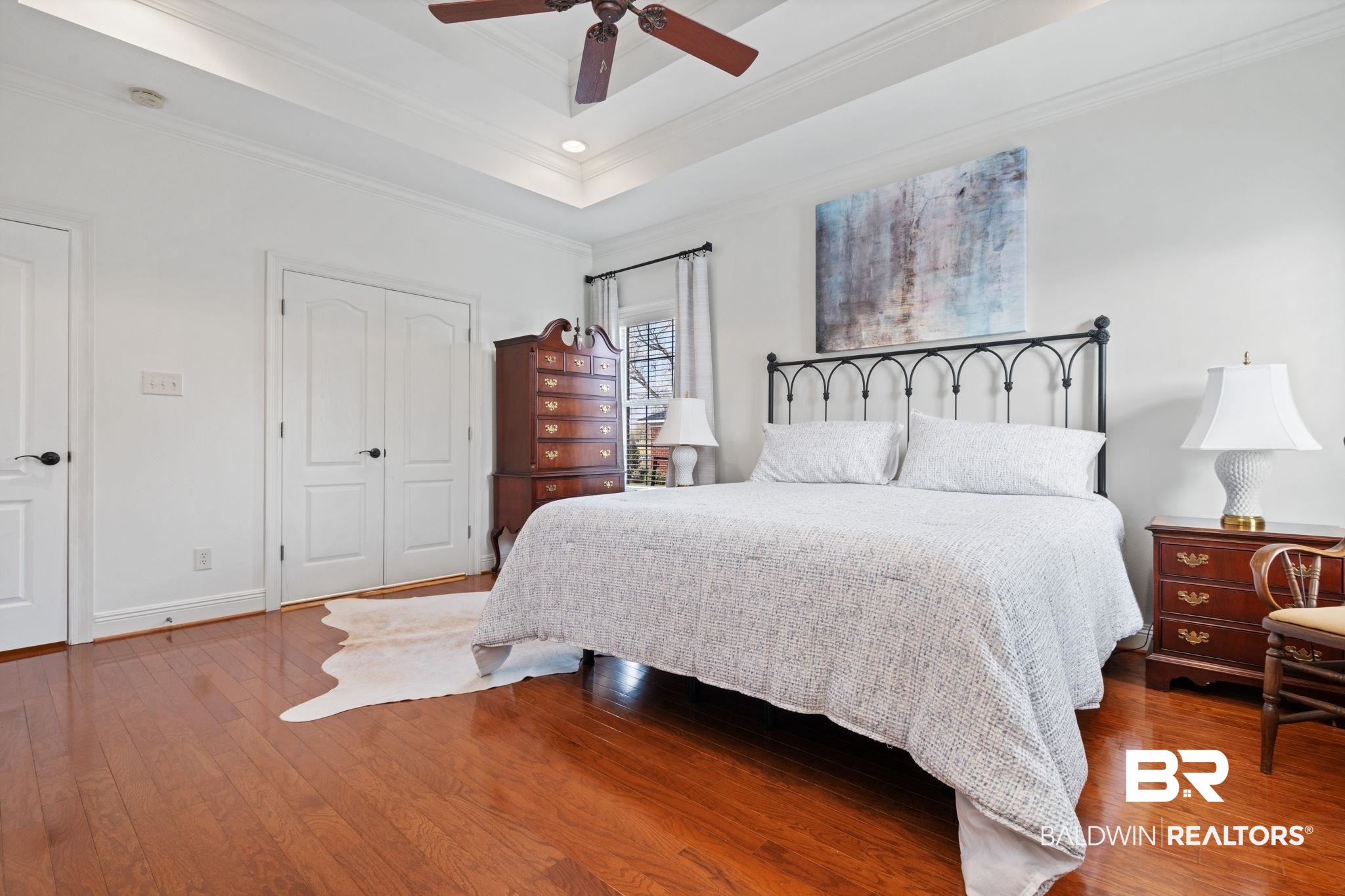 4771 Pecan Ridge East Mobile, AL 36619 - Photo 38 of 48 Bedroom with a closet, a raised ceiling, wood finished floors, ceiling fan, and ornamental molding