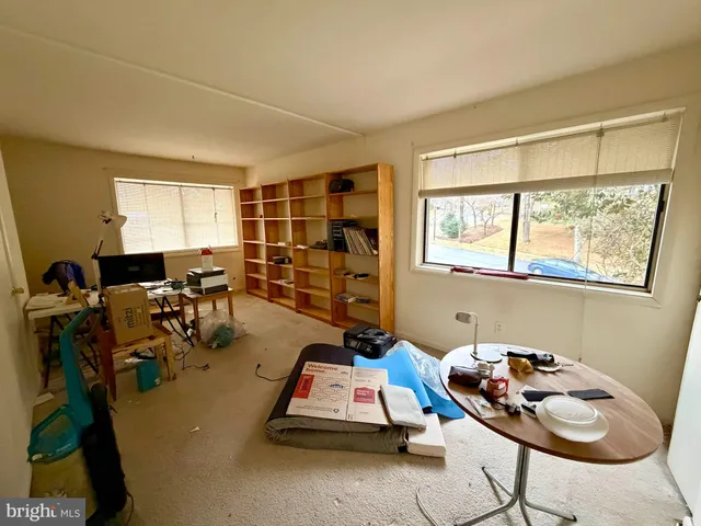 a room with gym equipment and window