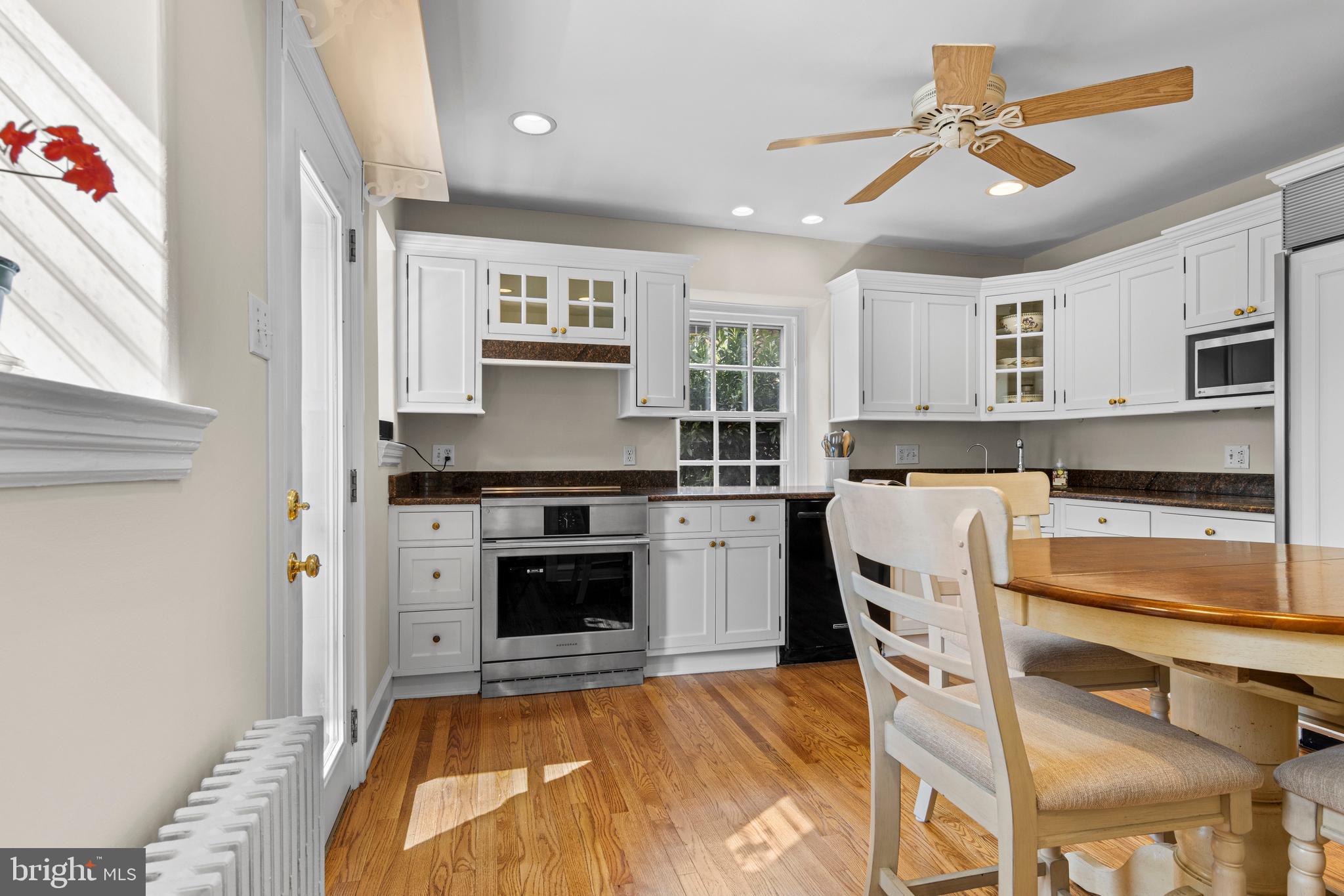510 Anthwyn Road Merion Station, PA 19066 - Photo 11 of 30 a kitchen with kitchen island a stove a sink and a refrigerator