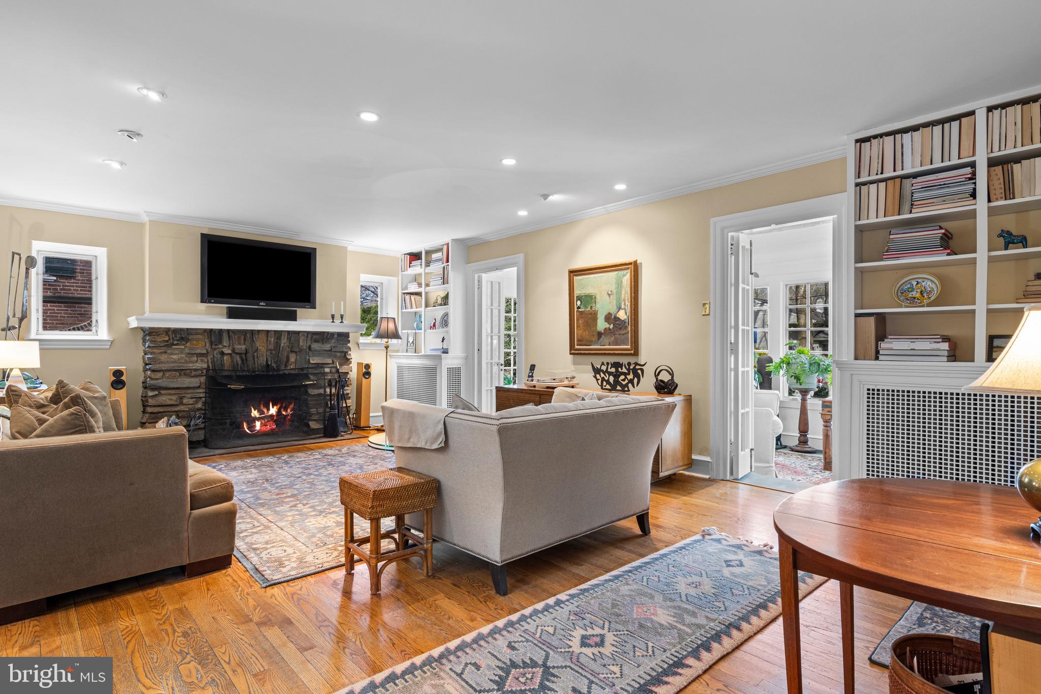 510 Anthwyn Road Merion Station, PA 19066 - Photo 6 of 30 a living room with furniture a flat screen tv and a fireplace