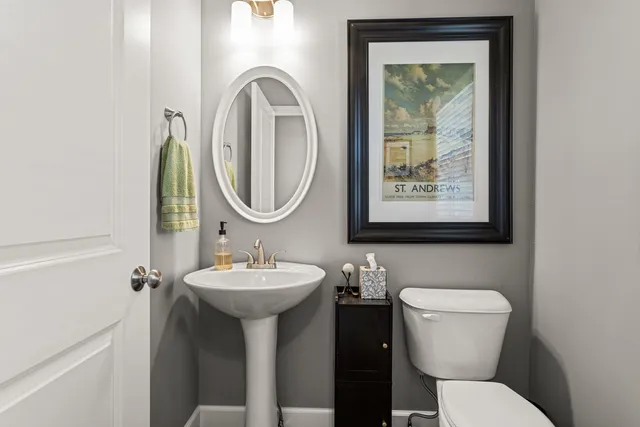 a bedroom with a bed and a ceiling fan