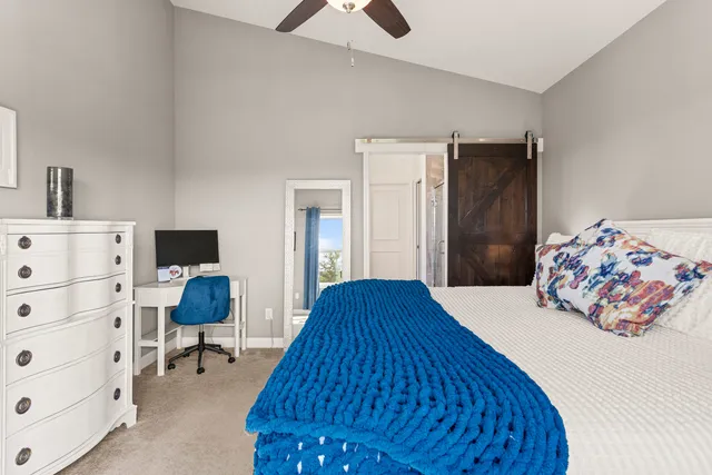 a en suite bathroom with a double vanity sink and a mirror