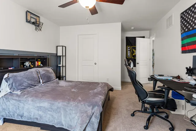 a bathroom with a double vanity sink mirror and toilet